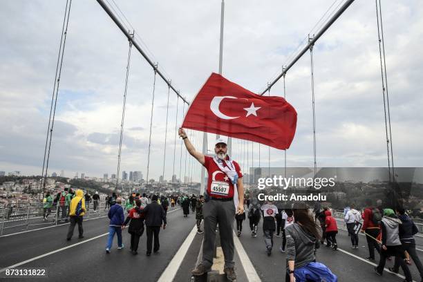 Participants compete during Vodafone 39th Istanbul Marathon at The 15 July Martyrs Bridge in Istanbul, Turkey on November 12, 2017. It is the only...