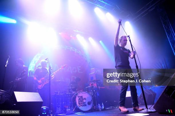 Scott Von RyperÊ, Mark Crozer, Brian Young, Jim Reid, and William Reid of The Jesus And Mary Chain performs at Headliners Music Hall on November 11,...