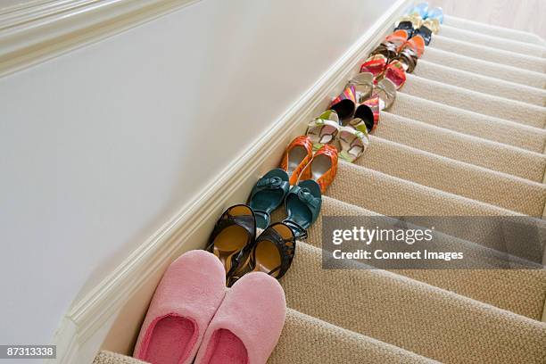 shoes on staircase - pair stock pictures, royalty-free photos & images