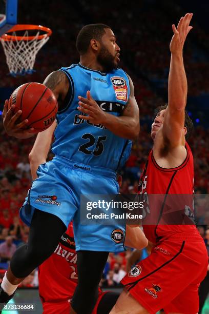 Newbill of the Breakers looks for an outlet pass against Damian Martin of the Wildcats during the round six NBL match between the Perth Wildcats and...