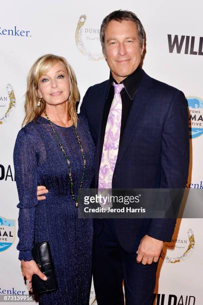 Bo Derek and John Corbett arrive at 'Evening With WildAid' at the Beverly Wilshire Four Seasons Hotel on November 11, 2017 in Beverly Hills,...