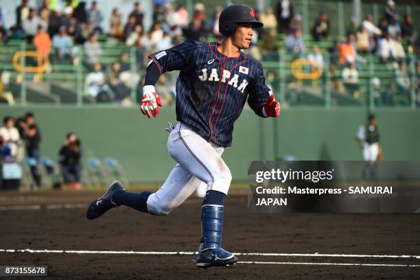 Yota Kyoda of Samurai Japan runs to first base during the practice game between Japan and Hokkaido Nippon Ham Fighters at Sokken Stadium on November...