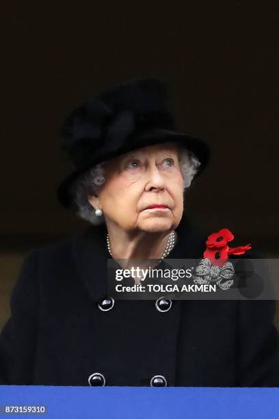 Britain's Queen Elizabeth II attends the Remembrance Sunday ceremony at the Cenotaph on Whitehall in central London, on November 12, 2017. Services...