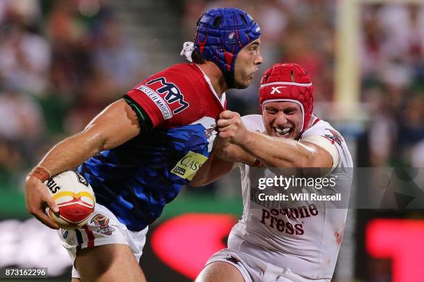 Benjamin Jullien of France is tackled by Chris Hill of England during the 2017 Rugby League World Cup match between England and France at nib Stadium...