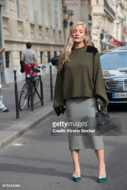 Fashion stylist and consultant Kate Foley Osterweis wears a Mother of Pearl sweater, Calvin Klein bag, Manolo Blahnik shoes and a Miu Miu skirt day 4...