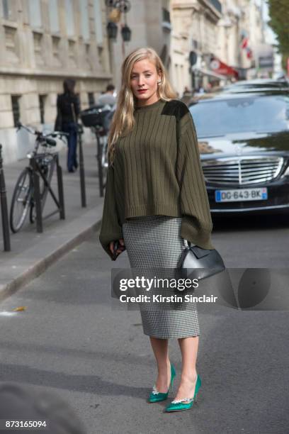 Fashion stylist and consultant Kate Foley Osterweis wears a Mother of Pearl sweater, Calvin Klein bag, Manolo Blahnik shoes and a Miu Miu skirt day 4...