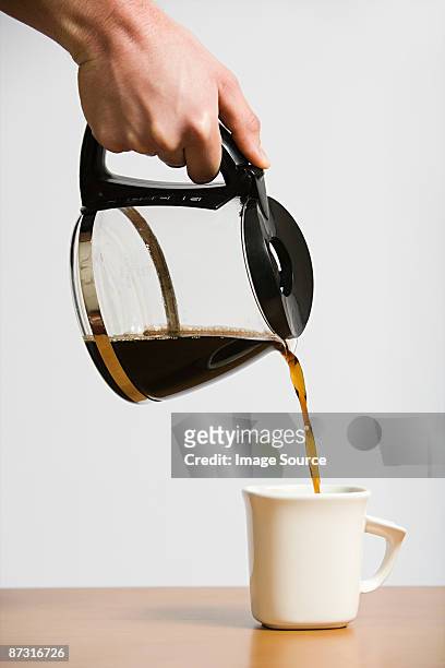 person pouring coffee - pouring stock pictures, royalty-free photos & images
