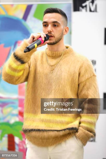 Musician C. Tangana speaks on stage during a press conference to announce Bilbao as the host city for the EMA's 2018 at MTV London on November 12,...