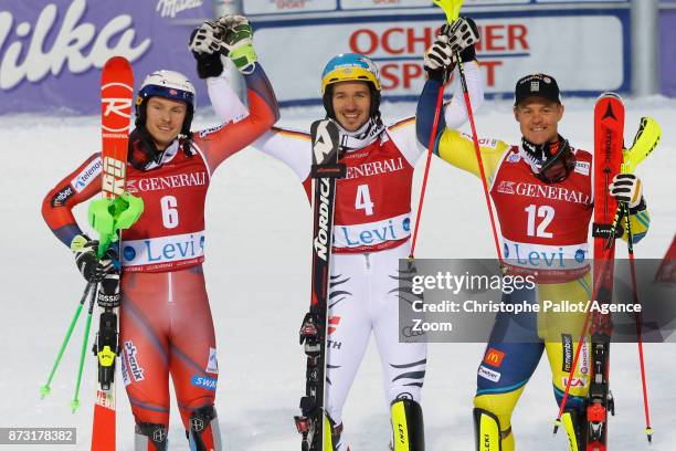 Henrik Kristoffersen of Norway takes 2nd place, Felix Neureuther of Germany takes 1st place, Mattias Hargin of Sweden takes 3rd place during the Audi...