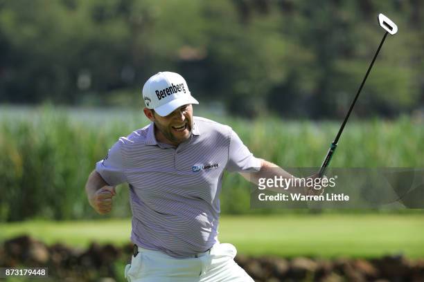 Branden Grace of South Africa celebrates a birdie on the 16th green during the final round of the Nedbank Golf Challenge at Gary Player CC on...