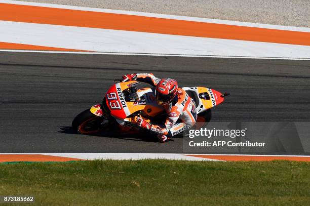 Repsol Honda Team's Spanish rider Marc Marquez rides during the MotoGP race of the Valencia Grand Prix at Ricardo Tormo racetrack in Cheste, near...