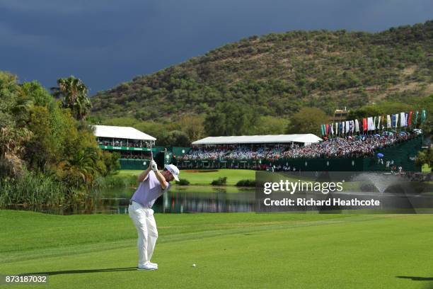 Branden Grace of South Africa hits an approach shot to the 18th green during the final round of the Nedbank Golf Challenge at Gary Player CC on...