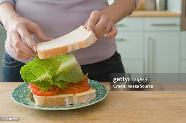 woman making sandwich - woman sandwich stock pictures, royalty-free photos & images