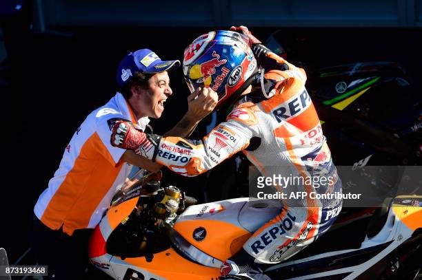 Repsol Honda Team's Spanish rider Dani Pedrosa celebrates after winning the MotoGP race of the Valencia Grand Prix at Ricardo Tormo racetrack in...