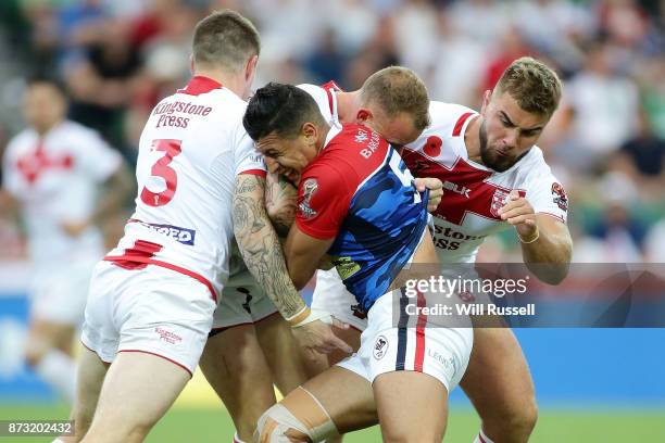 Ilias Bergal of France is tackled during the 2017 Rugby League World Cup match between England and France at nib Stadium on November 12, 2017 in...