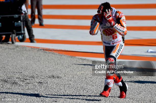 Repsol Honda Team's Spanish rider Marc Marquez reacts after the MotoGP race of the Valencia Grand Prix at Ricardo Tormo racetrack in Cheste, near...