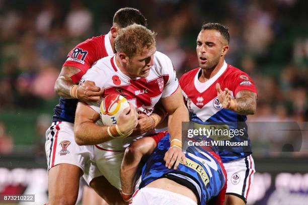 Thomas Burgess of England is tackled during the 2017 Rugby League World Cup match between England and France at nib Stadium on November 12, 2017 in...