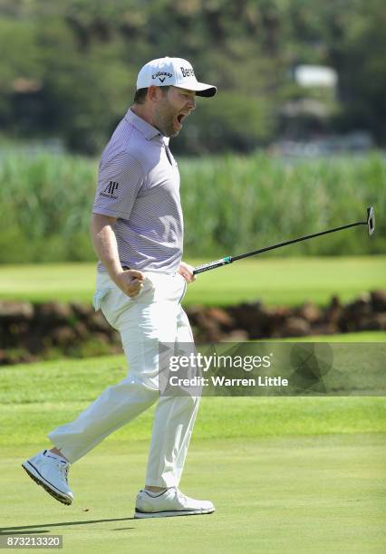 Branden Grace of South Africa celebrates a birdie putt in the 16th hole en route to winning the Nedbank Golf Challenge at Gary Player CC on November...