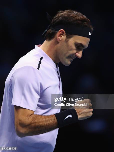 Roger Federer of Switzerland celebrates a point against Jack Sock of the United States during the Nitto ATP World Tour Finals at O2 Arena on November...