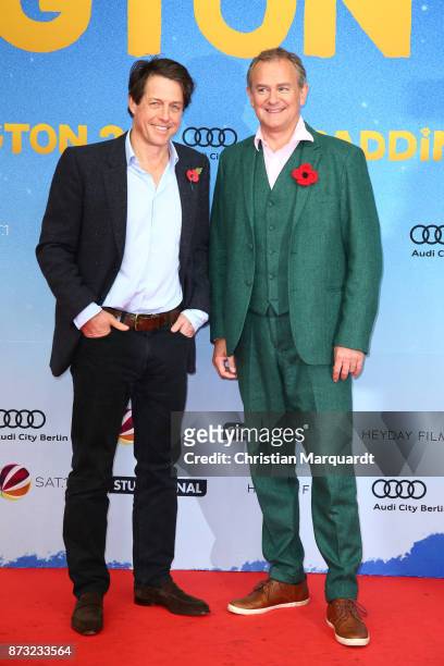 Hugh Grant and Hugh Bonneville attend the 'Paddington 2' premiere at Zoo Palast on November 12, 2017 in Berlin, Germany.