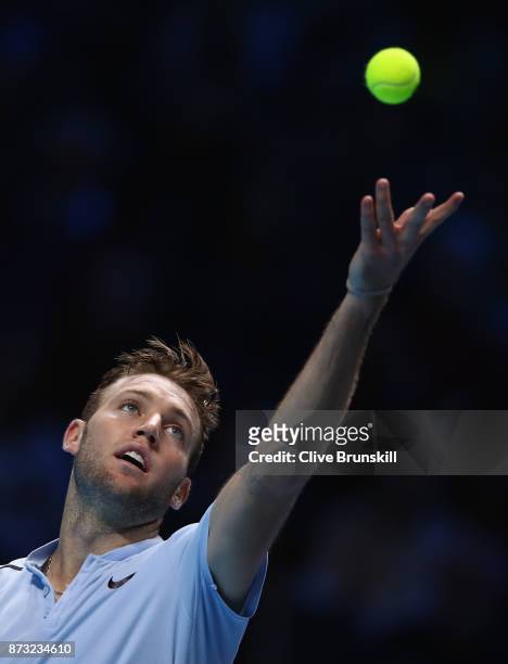 Jack Sock of the United States serves against Roger Federer of Switzerland during the Nitto ATP World Tour Finals at O2 Arena on November 12, 2017 in...