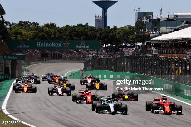 Valtteri Bottas driving the Mercedes AMG Petronas F1 Team Mercedes F1 WO8 and Sebastian Vettel of Germany driving the Scuderia Ferrari SF70H lead...