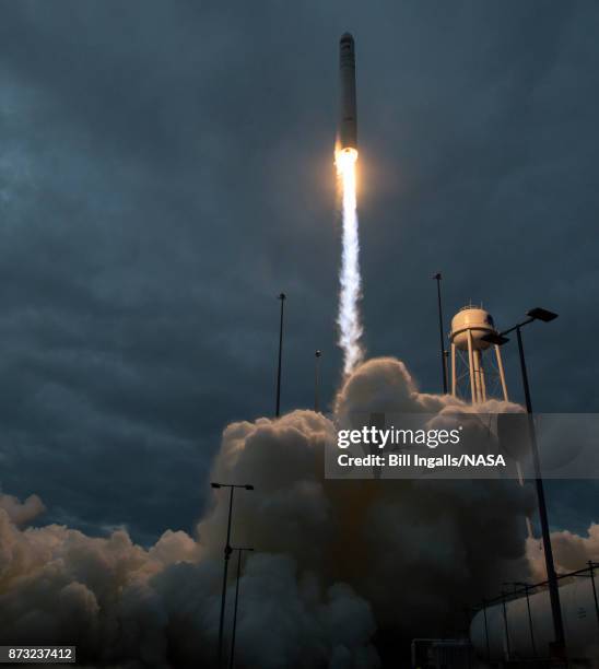 In this handout provided by the National Aeronautics and Space Administration , The Orbital ATK Antares rocket, with the Cygnus spacecraft onboard,...