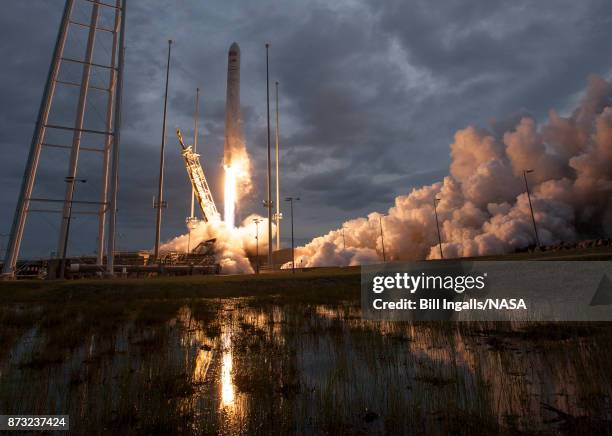 In this handout provided by the National Aeronautics and Space Administration , The Orbital ATK Antares rocket, with the Cygnus spacecraft onboard,...