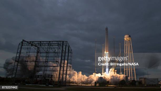 In this handout provided by the National Aeronautics and Space Administration , The Orbital ATK Antares rocket, with the Cygnus spacecraft onboard,...