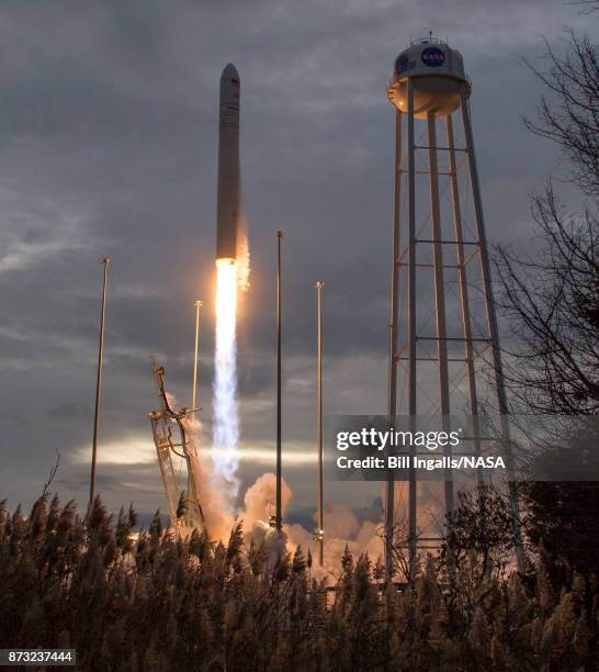 In this handout provided by the National Aeronautics and Space Administration , The Orbital ATK Antares rocket, with the Cygnus spacecraft onboard,...