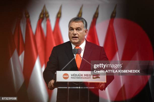 Reelected chairman of the governing FIDESZ party, Hungarian Prime Minister Viktor Orban, talks on the podium during the party congress at the...