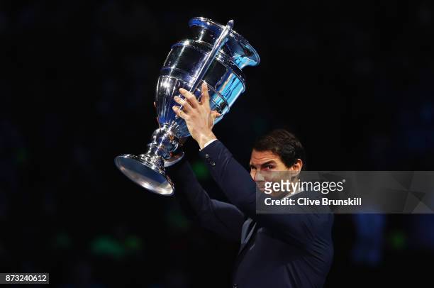 Rafael Nadal of Spain holds aloft the Emirates ATP year end World Number One trophy after a presentation to him on the first day of the Nitto ATP...