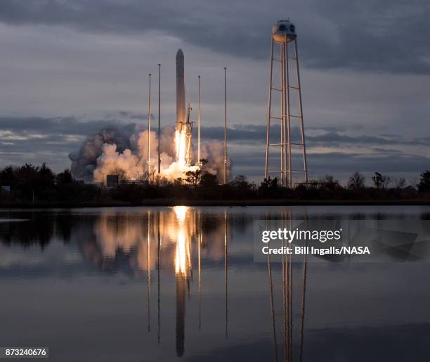 In this handout provided by the National Aeronautics and Space Administration , The Orbital ATK Antares rocket, with the Cygnus spacecraft onboard,...