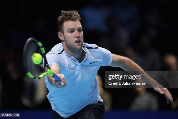 Jack Sock of USA in action in his match against Roger Federer of Switzerland during day one of the Nitto ATP World Tour Finals tennis at the O2 Arena...