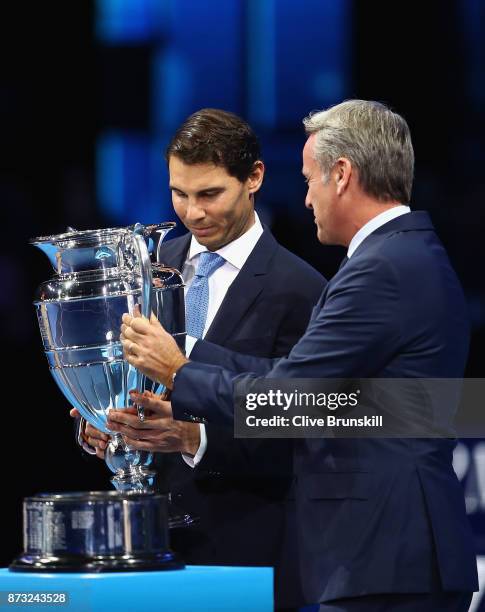 Rafael Nadal of Spain receives the Emirates ATP year end World Number One trophy from ATP CEO Chris Kermode after a presentation to him on the first...