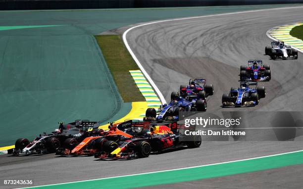 Daniel Ricciardo of Australia driving the Red Bull Racing Red Bull-TAG Heuer RB13 TAG Heuer Stoffel Vandoorne of Belgium driving the McLaren Honda...