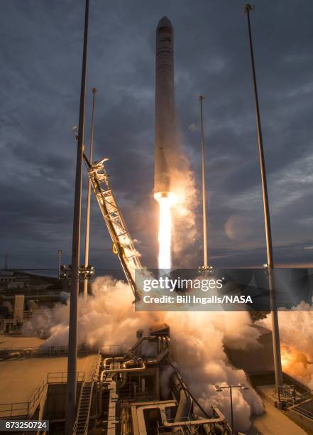 In this handout provided by the National Aeronautics and Space Administration , The Orbital ATK Antares rocket, with the Cygnus spacecraft onboard,...