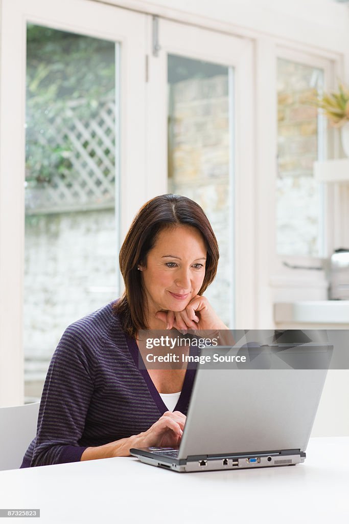 Mature woman using a laptop