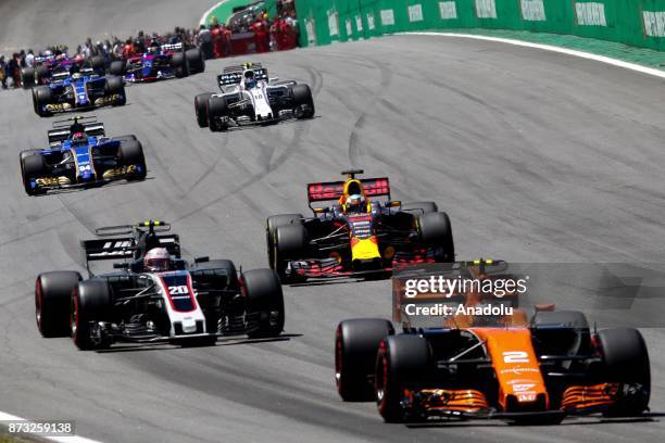 Drivers compete during the Brazilian Formula One Grand Prix, at the Jose Carlos Pace racetrack in Sao Paulo, Brazil on November 12, 2017.