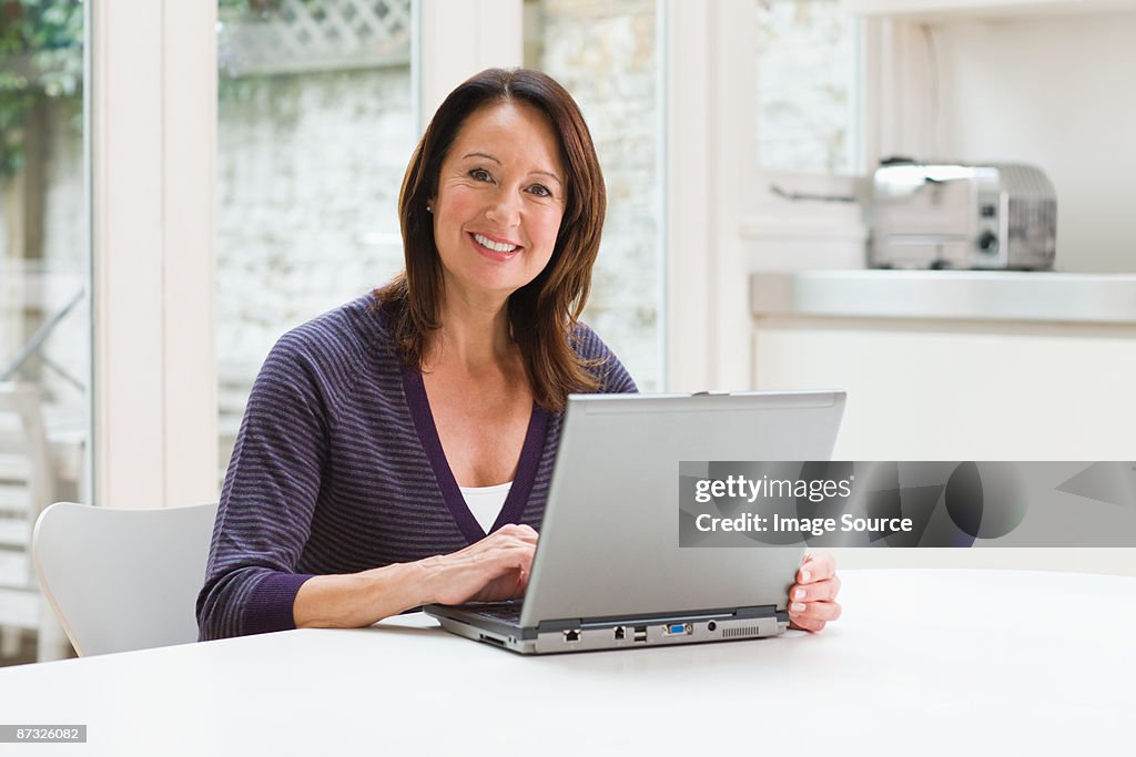 Mature woman using a laptop