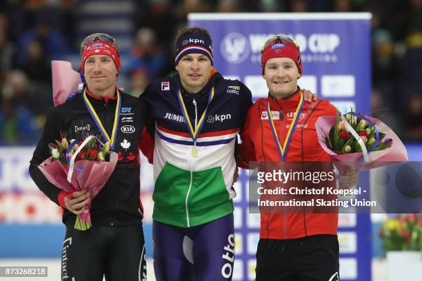 Ted-Jan Bloemen of Canada poses during the medal ceremony after winning the 2nd place, Sven Krahmer of the Netherlands poses during the medal...