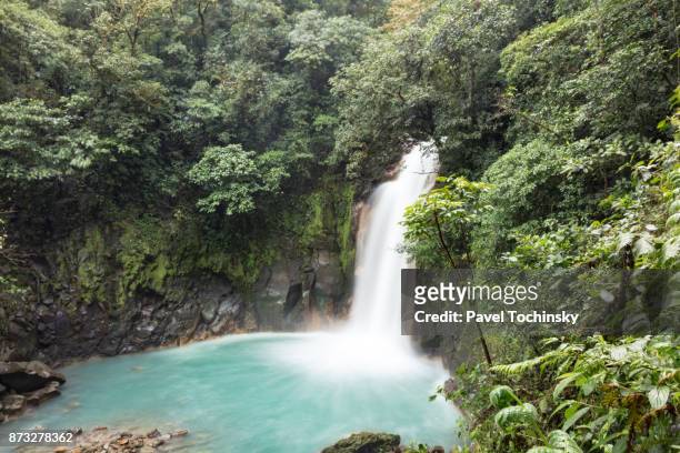 rio celeste waterfall in tenorio volcano national park, costa rica - tenorio volcano national park stock pictures, royalty-free photos & images