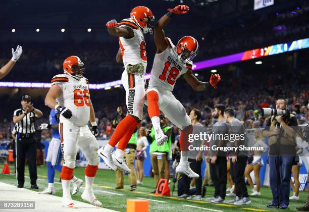 Kenny Britt of the Cleveland Browns celebrates his touchdown with teammates Ricardo Louis of the Cleveland Browns and Spencer Drango against the...