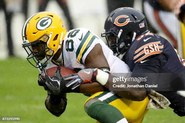 Christian Jones of the Chicago Bears tackles Ty Montgomery of the Green Bay Packers in the first quarter at Soldier Field on November 12, 2017 in...