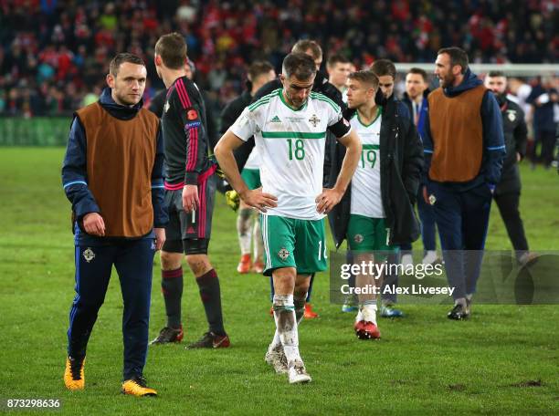 Oliver Norwood of Northern Ireland and team mates look dejected following the FIFA 2018 World Cup Qualifier Play-Off: Second Leg between Switzerland...