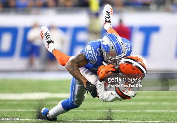 Darius Slay of the Detroit Lions makes a tackle against Rashard Higgins of the Cleveland Browns during the first half at Ford Field on November 12,...