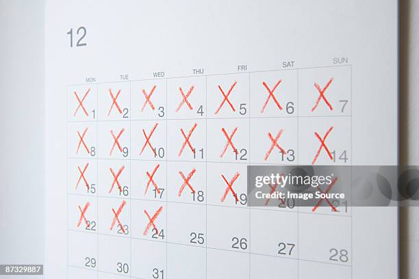 dates crossed of on a calendar - red x stock pictures, royalty-free photos & images