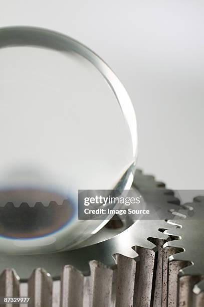 a crystal ball and machine cogs - fortune telling machine stock pictures, royalty-free photos & images