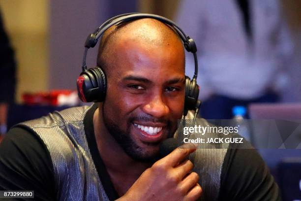 French judoka Teddy Riner answers journalists questions after his victory in the Judo World Championships Open in Marrakesh on November 12, 2017. -...