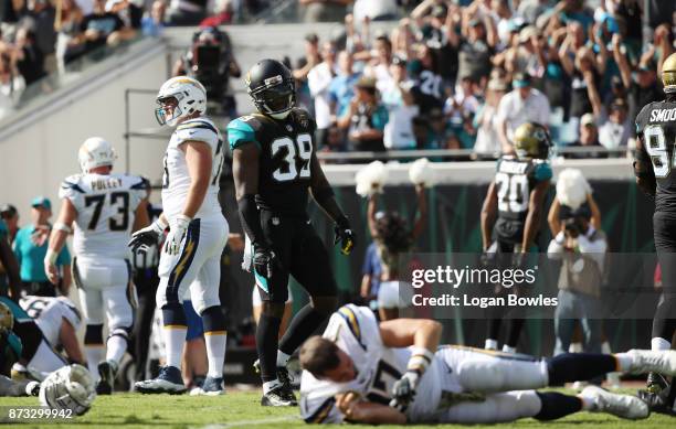 Tashaun Gipson of the Jacksonville Jaguars looks at Philip Rivers of the Los Angeles Chargers on the field during the first half of their game at...